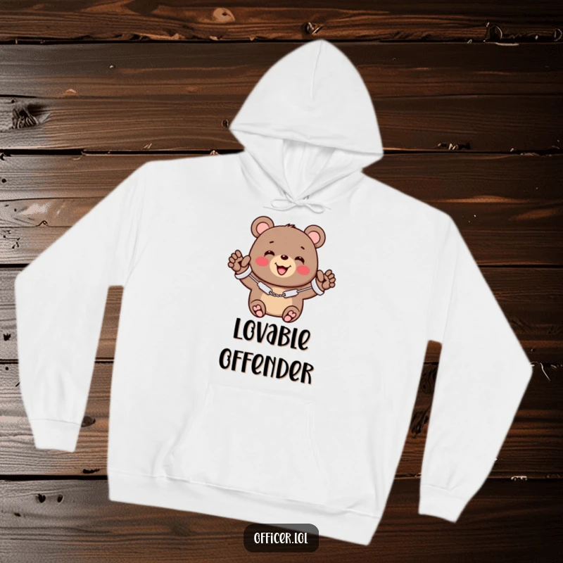 Funny hoodie depicting a cheerful bear wearing miniature handcuffs, smiling warmly and offering a friendly wave.