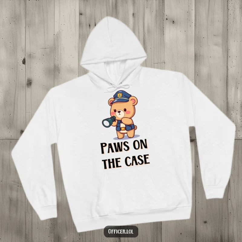 Funny police bear hoodie, a cozy and warm garment with a brave officer directing light into the dark.