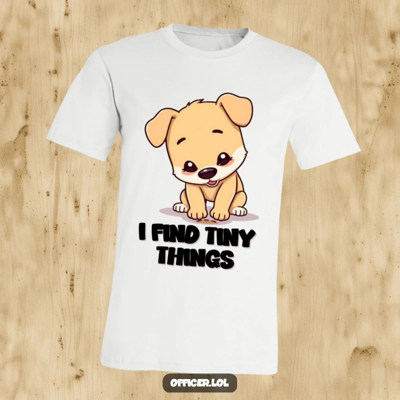 Funny Dog T-Shirt: A happy dog character wears a tiny detective hat, peering intensely at a single, small footprint on the ground.